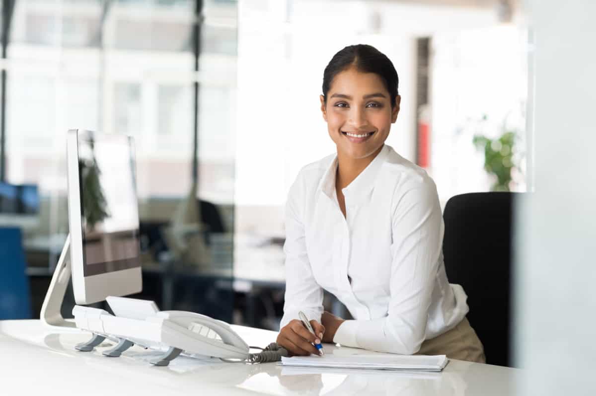 Cheerful woman in office