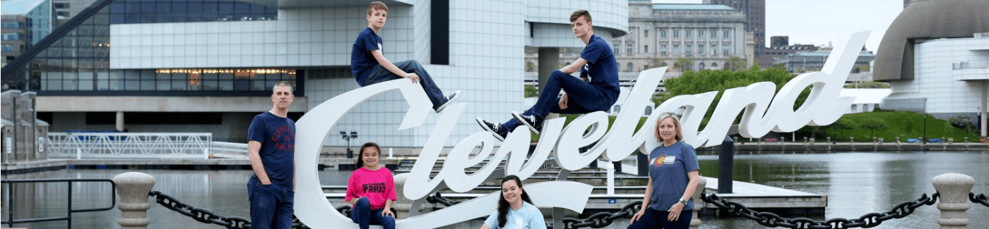 A group of people posing at different levels on a large outdoor 3d 