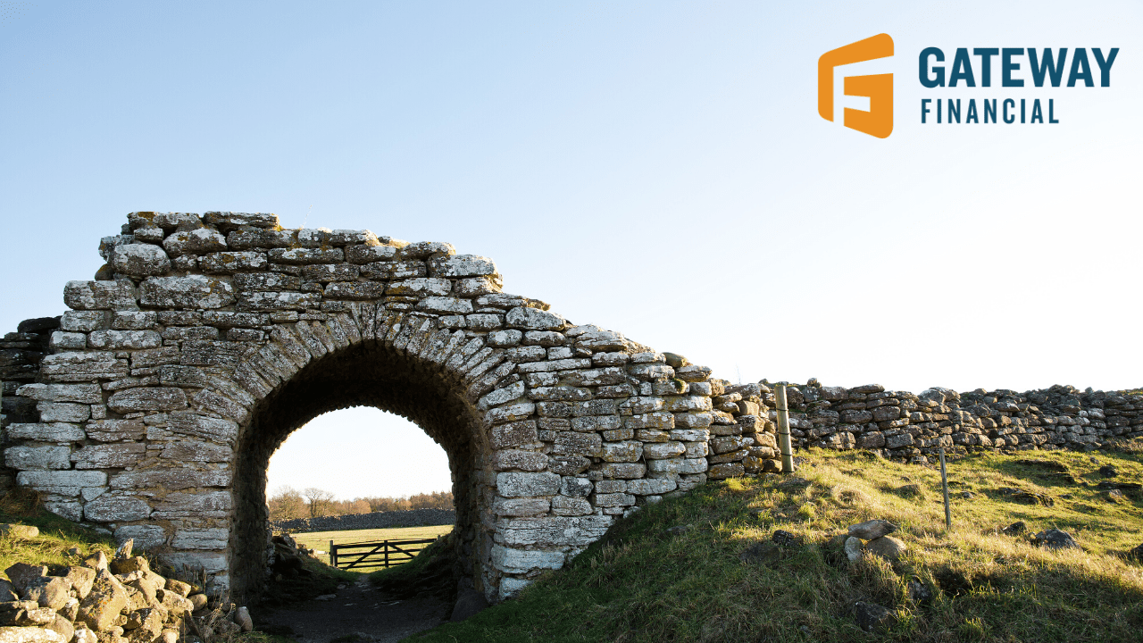 An ancient stone archway standing gracefully amidst a serene landscape, under the vast expanse of a clear blue sky, with a logo of 