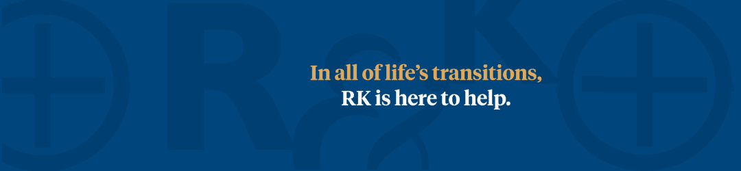 Professional corporate banner with the reassuring message: 'in all of life's transitions, rk is here to help,' set against a serene blue background.